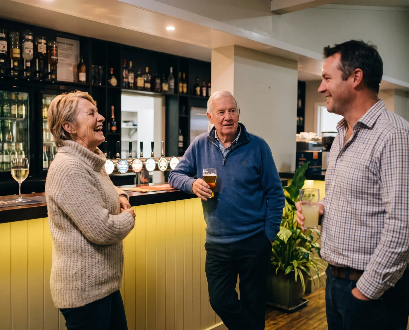 Three people sharing a drink at the Birkenhead RSA bar