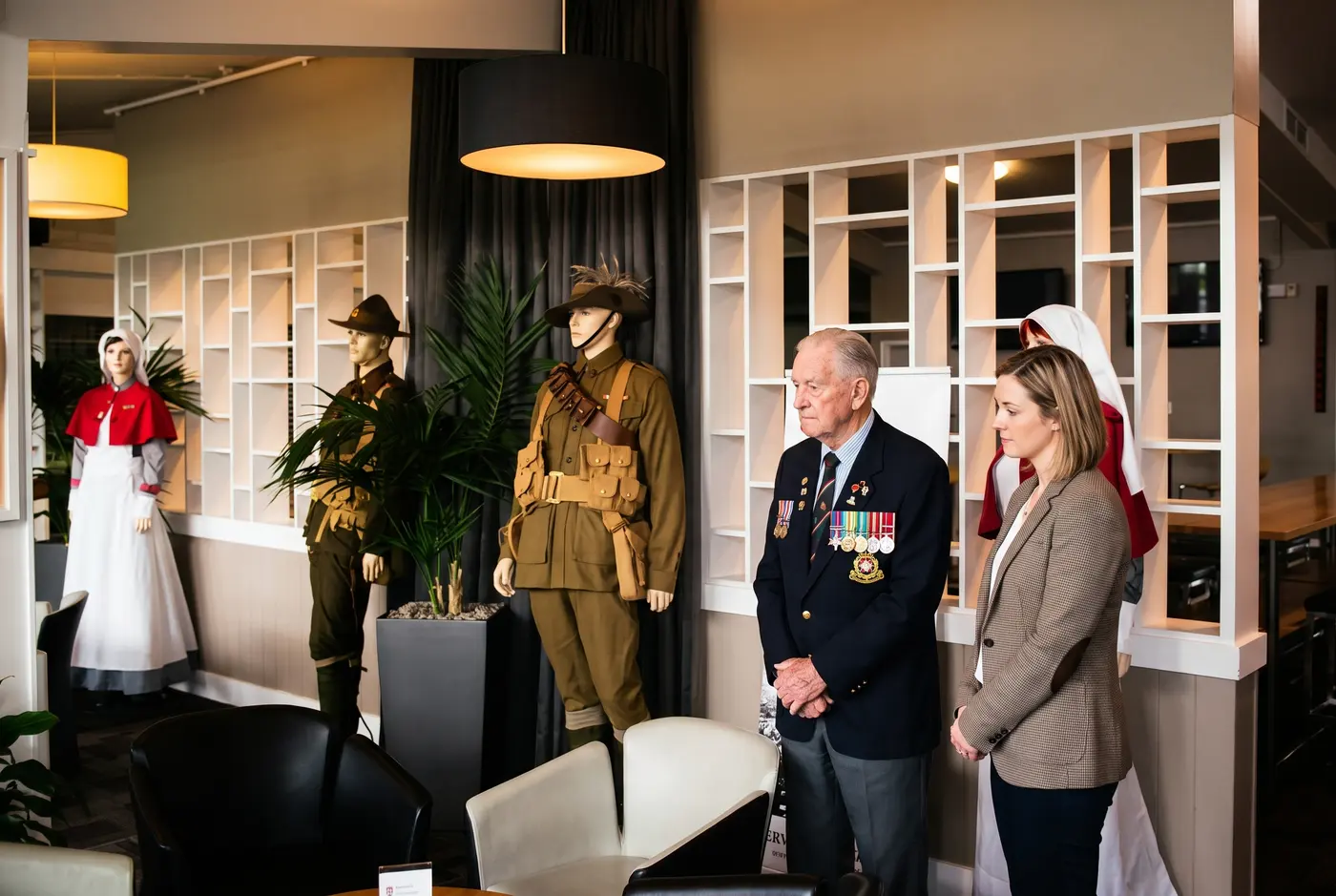 People looking at the heritage display in the Birkenhead RSA clubrooms