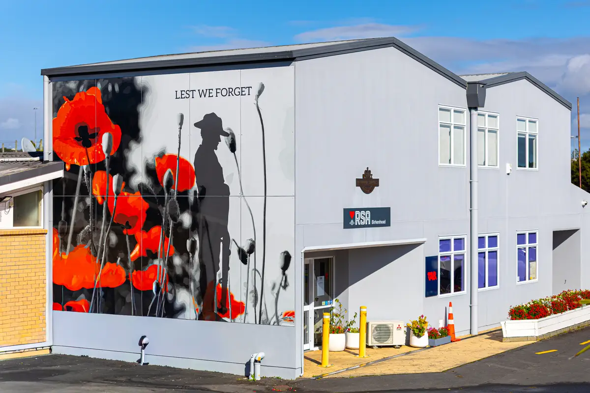 The Birkenhead RSA clubrooms on Recreation Drive, with the club's Lest We Forget poppy mural across the front wall.